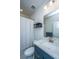 Clean bathroom with navy vanity, marble countertop, and shower at 178 Wappoo Trace Ln, Summerville, SC 29486