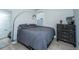 Cozy bedroom with gray bedding and a vintage dresser at 178 Wappoo Trace Ln, Summerville, SC 29486