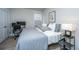 Bright bedroom with a workspace and gray bedding at 178 Wappoo Trace Ln, Summerville, SC 29486