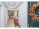 Bright and spacious entryway with hardwood floors and a decorative mirror at 178 Wappoo Trace Ln, Summerville, SC 29486