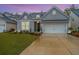 Charming house with a gray exterior, landscaping, and a two-car garage at 178 Wappoo Trace Ln, Summerville, SC 29486