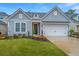 Gray sided home with white garage door and landscaped lawn at 178 Wappoo Trace Ln, Summerville, SC 29486