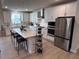 Modern kitchen with white cabinets and large island at 178 Wappoo Trace Ln, Summerville, SC 29486
