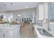 Modern kitchen with white cabinets, quartz countertops, and stainless steel appliances at 178 Wappoo Trace Ln, Summerville, SC 29486