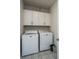 Laundry room features built-in cabinets and a full-size washer and dryer at 178 Wappoo Trace Ln, Summerville, SC 29486