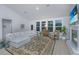 Bright living room with a cozy fireplace, large windows, and comfortable seating at 178 Wappoo Trace Ln, Summerville, SC 29486