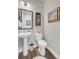 Clean and updated half bathroom with pedestal sink at 203 Oak View Way, Summerville, SC 29483
