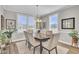 Bright dining room with hardwood floors and elegant light fixture at 203 Oak View Way, Summerville, SC 29483