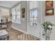 Bright entryway with hardwood floors, a white door and lovely decor at 203 Oak View Way, Summerville, SC 29483