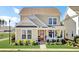 Charming 2-story house with a welcoming front porch and landscaped yard at 203 Oak View Way, Summerville, SC 29483