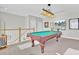 Game room with pool table, wall art, and large TV at 203 Oak View Way, Summerville, SC 29483
