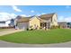 House exterior view, showcasing the yellow siding and screened porch at 203 Oak View Way, Summerville, SC 29483