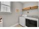 Convenient laundry room with washer, dryer, and shelving at 203 Oak View Way, Summerville, SC 29483