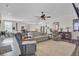 Open living room with hardwood floors, comfortable seating and view of kitchen at 203 Oak View Way, Summerville, SC 29483
