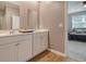 Double vanity bathroom with modern white cabinets at 219 Greenwich Dr, Summerville, SC 29486