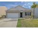 Brick house with a white garage door and landscaping at 219 Greenwich Dr, Summerville, SC 29486