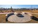 Stone firepit with seating area in a community space at 219 Greenwich Dr, Summerville, SC 29486