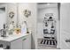 Bathroom with white vanity and entry to a mudroom with bench at 221 Rubles Ln, Moncks Corner, SC 29461