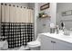 Bathroom with black and white checkered shower curtain and white vanity at 221 Rubles Ln, Moncks Corner, SC 29461