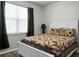 Cozy bedroom with a white bed frame and bear quilt at 221 Rubles Ln, Moncks Corner, SC 29461