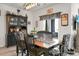 Farmhouse-style dining room features a wooden table and black hutch at 221 Rubles Ln, Moncks Corner, SC 29461