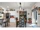 Open dining area features a farmhouse table and black hutch with a view of the kitchen at 221 Rubles Ln, Moncks Corner, SC 29461
