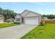 Single-story home with attached garage and landscaped lawn at 221 Rubles Ln, Moncks Corner, SC 29461