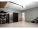 Garage with shelving, refrigerator, and extra storage at 221 Rubles Ln, Moncks Corner, SC 29461