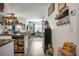Open kitchen features granite countertops, stainless steel appliances, and farmhouse-style decor at 221 Rubles Ln, Moncks Corner, SC 29461