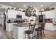 Modern kitchen with white cabinets, granite island, and stainless steel appliances at 221 Rubles Ln, Moncks Corner, SC 29461
