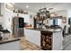 Spacious kitchen boasts white cabinets, granite island, and stainless steel appliances at 221 Rubles Ln, Moncks Corner, SC 29461