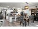 Bright kitchen features an island, white cabinets, and a farmhouse-style pot rack at 221 Rubles Ln, Moncks Corner, SC 29461