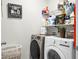 Clean laundry room featuring washer, dryer, and shelving at 221 Rubles Ln, Moncks Corner, SC 29461