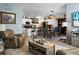 Open living area with leather furniture and view of kitchen and dining area at 221 Rubles Ln, Moncks Corner, SC 29461