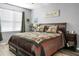 Cozy main bedroom with a comfortable bed and nightstand at 221 Rubles Ln, Moncks Corner, SC 29461