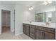 Bathroom with double vanity, modern fixtures, and tile flooring, featuring a glass-enclosed shower at 349 Blue Oak Dr, Moncks Corner, SC 29461