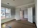 Bedroom featuring two sets of white doors, crown molding, and window overlooking neighborhood at 349 Blue Oak Dr, Moncks Corner, SC 29461