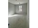 Bright, empty room featuring a window, concrete flooring, and fresh paint at 349 Blue Oak Dr, Moncks Corner, SC 29461