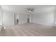 Carpeted bedroom with a ceiling fan, neutral walls, and view into a bathroom at 349 Blue Oak Dr, Moncks Corner, SC 29461