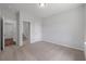 A bedroom with a view to the door of a bathroom and a walk-in closet, showing the carpet flooring at 349 Blue Oak Dr, Moncks Corner, SC 29461