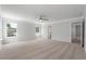 Carpeted bedroom with ceiling fan and natural light from dual windows; access to bathroom at 349 Blue Oak Dr, Moncks Corner, SC 29461