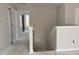 Upstairs hallway featuring a neutral color palette, white trim, and access to multiple rooms at 349 Blue Oak Dr, Moncks Corner, SC 29461