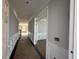Hallway with white chair rail and picture frame molding leading to additional rooms at 349 Blue Oak Dr, Moncks Corner, SC 29461