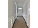 Bright hallway with white trim and wainscoting leads to the front door at 349 Blue Oak Dr, Moncks Corner, SC 29461