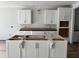 Unfinished kitchen showcasing modern white cabinetry awaiting countertops and appliances at 349 Blue Oak Dr, Moncks Corner, SC 29461