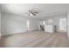 Upstairs loft area boasts neutral carpet, a ceiling fan, and access to multiple rooms at 349 Blue Oak Dr, Moncks Corner, SC 29461
