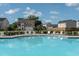 Community pool with lounge chairs and view of the surrounding neighborhood homes at 349 Blue Oak Dr, Moncks Corner, SC 29461
