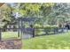 Landscaped backyard with wooden gate and pergola at 400 Bay Crossing Rd, Mount Pleasant, SC 29464