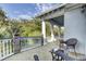 Covered balcony with wicker seating and view of the backyard at 400 Bay Crossing Rd, Mount Pleasant, SC 29464