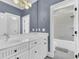 Bathroom with double vanity, white cabinets, and a shower at 400 Bay Crossing Rd, Mount Pleasant, SC 29464